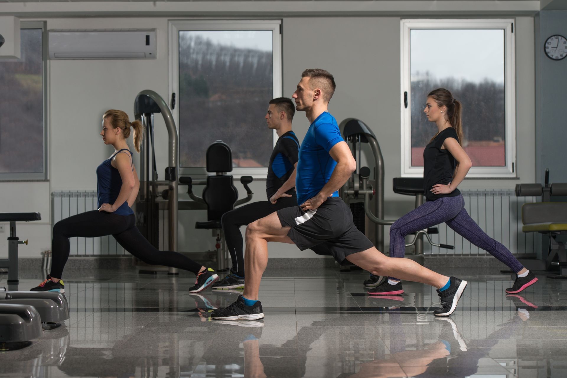 Group Of Friends Exercising Together During A Gym Class